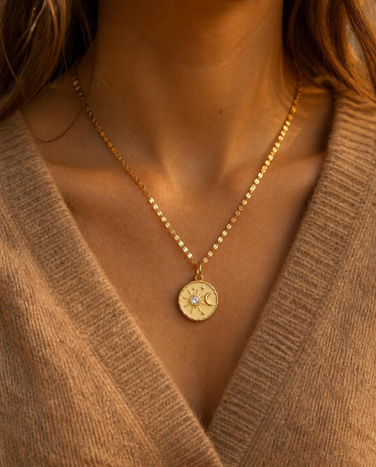 Disc Chain with the cream Reykjavik Coin worn with a camel sweater