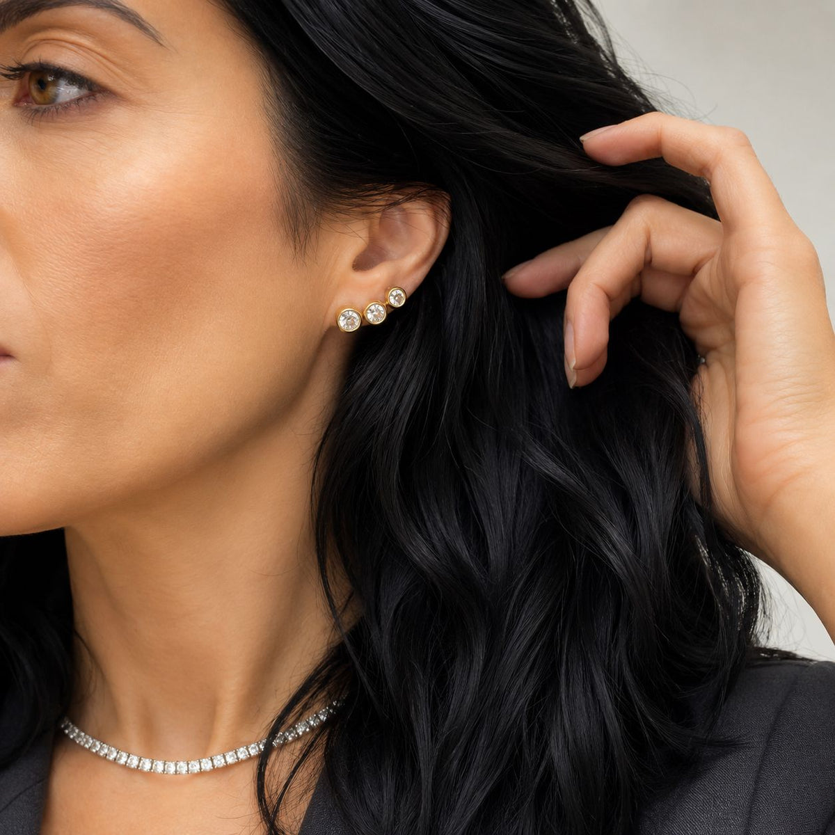 The Maggiore Studs in three sizes worn together on the ear