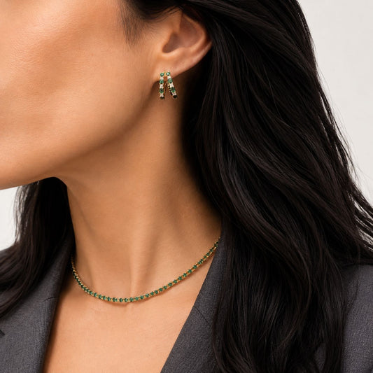Marbella Huggies in emerald worn on the ear