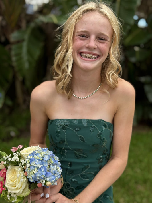 The Jodhpur Necklace in gold and emerald, worn