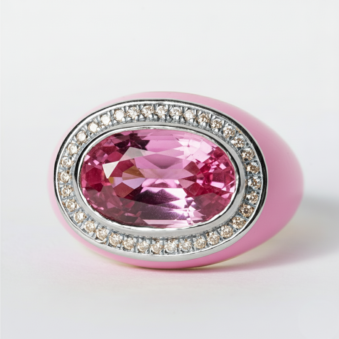 Pink gemstone ring with silver accents on a white background