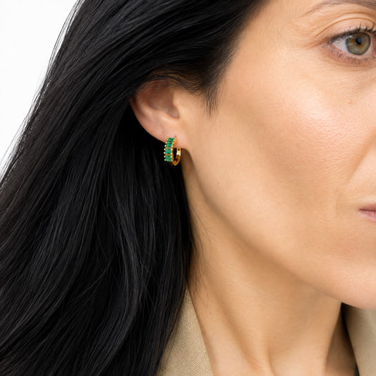 Gigi Huggies in emerald worn on the ear