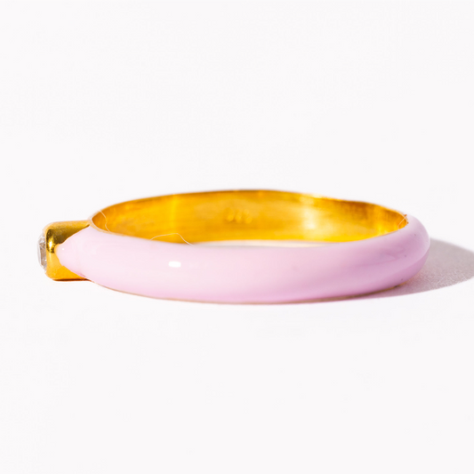 Pink and gold bangle on a white background
