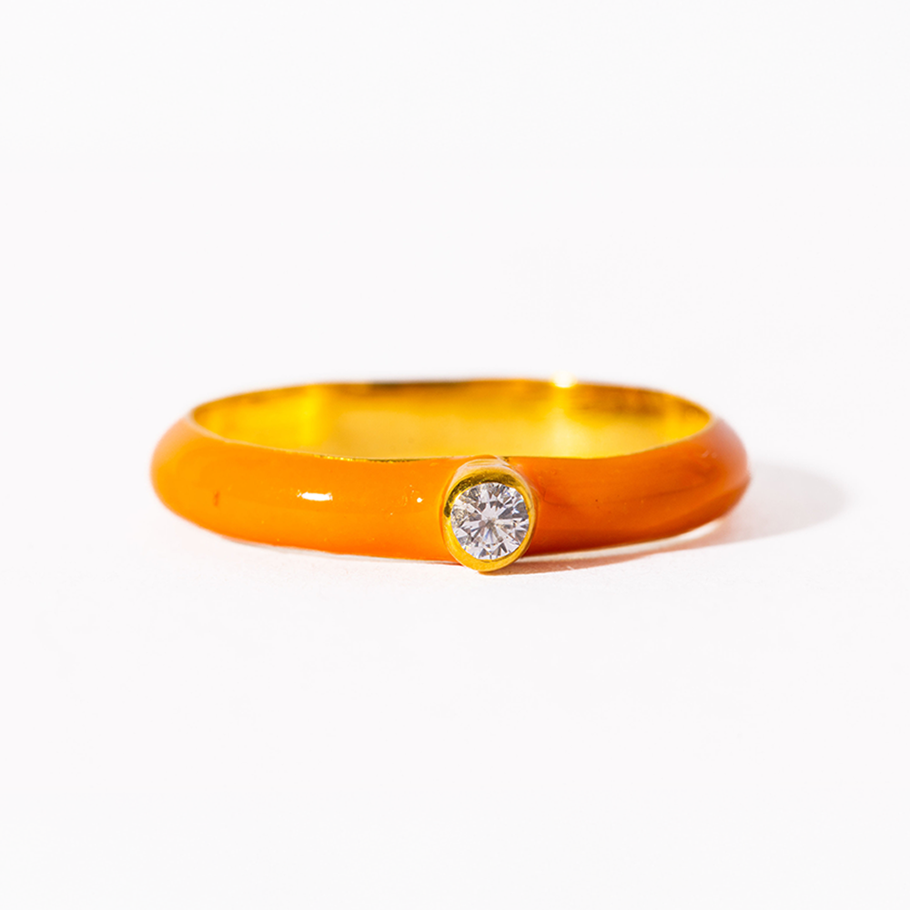 Gold bracelet with a diamond on a white background