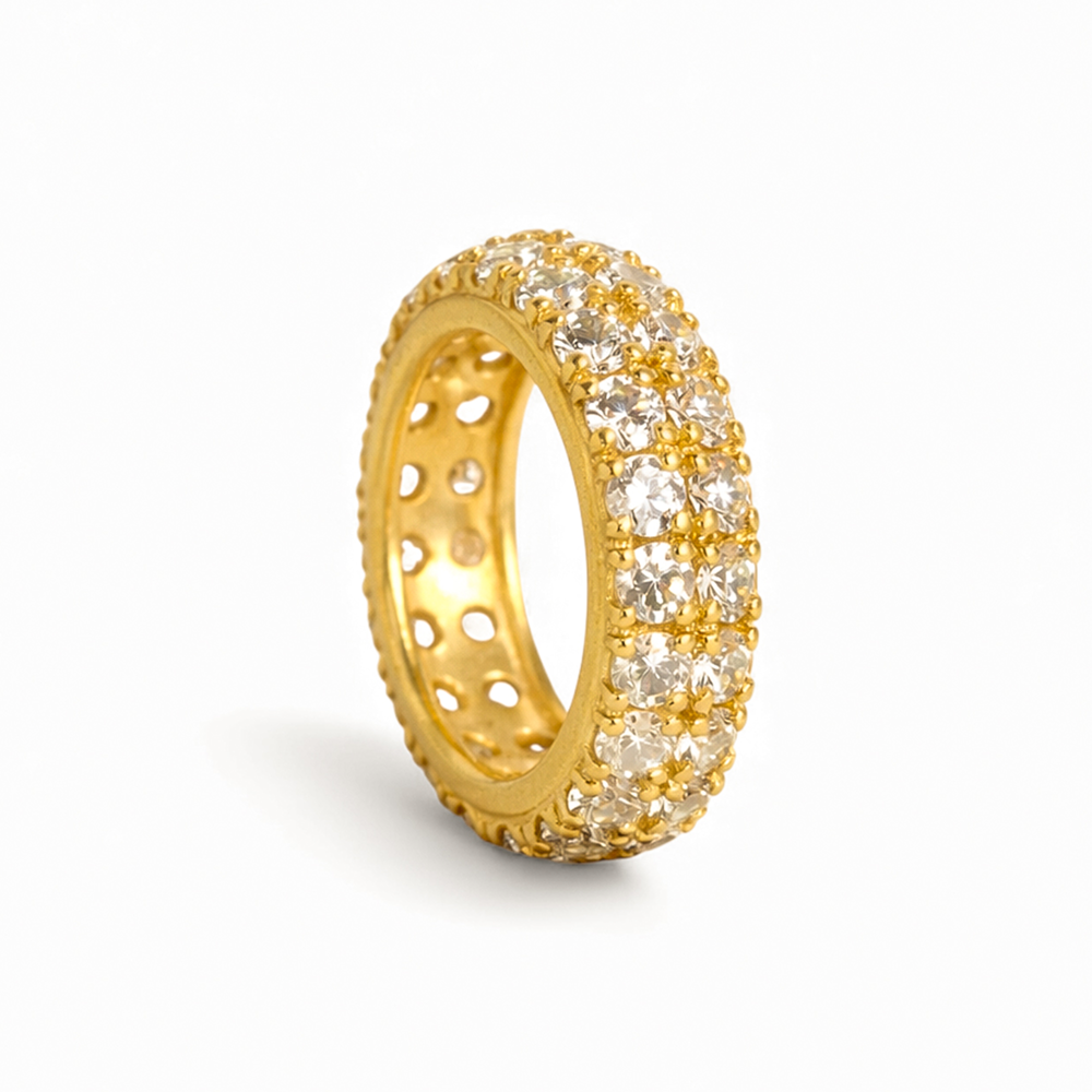Gold ring with embedded diamonds on a white background