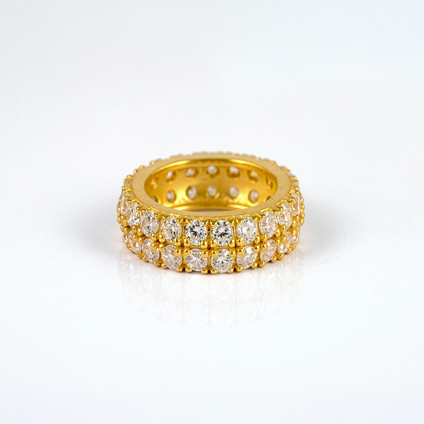 Gold ring with diamonds on a white background