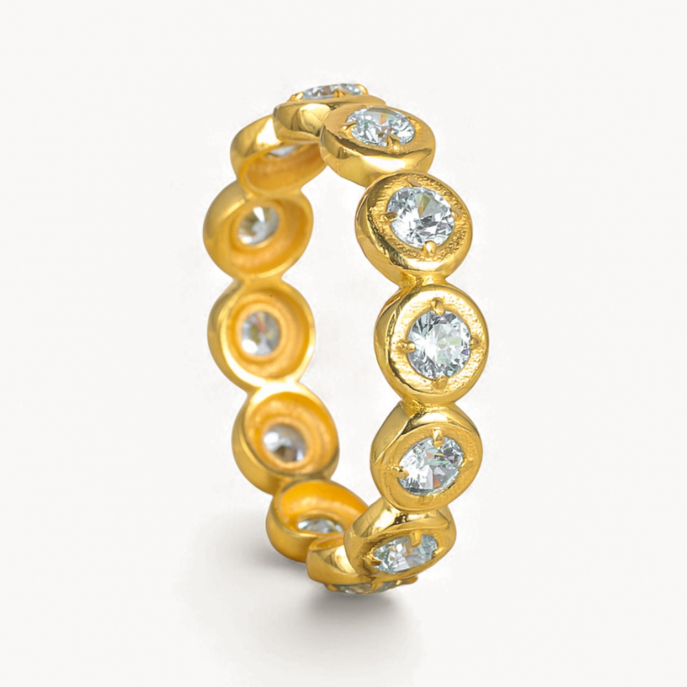 Gold ring with embedded diamonds on a white background