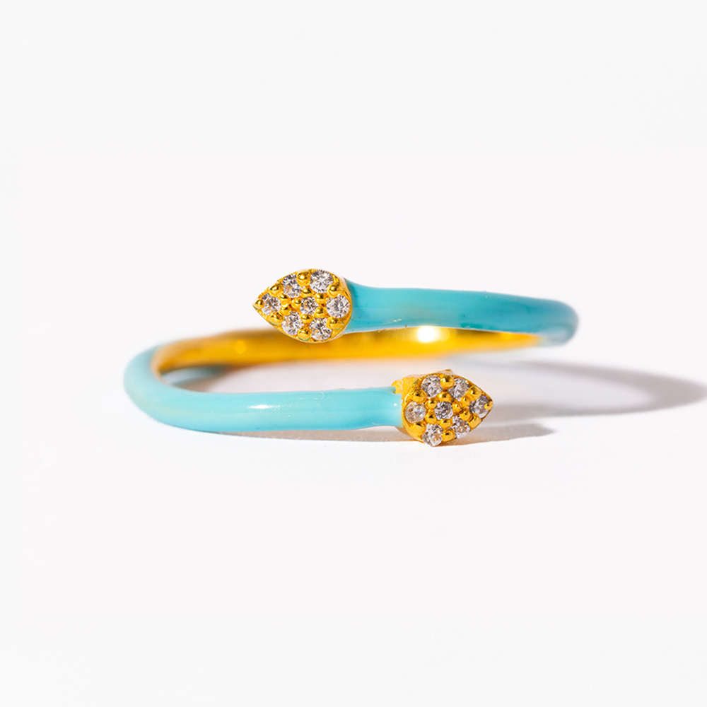 Two turquoise bangles with gold heart-shaped embellishments on a white background