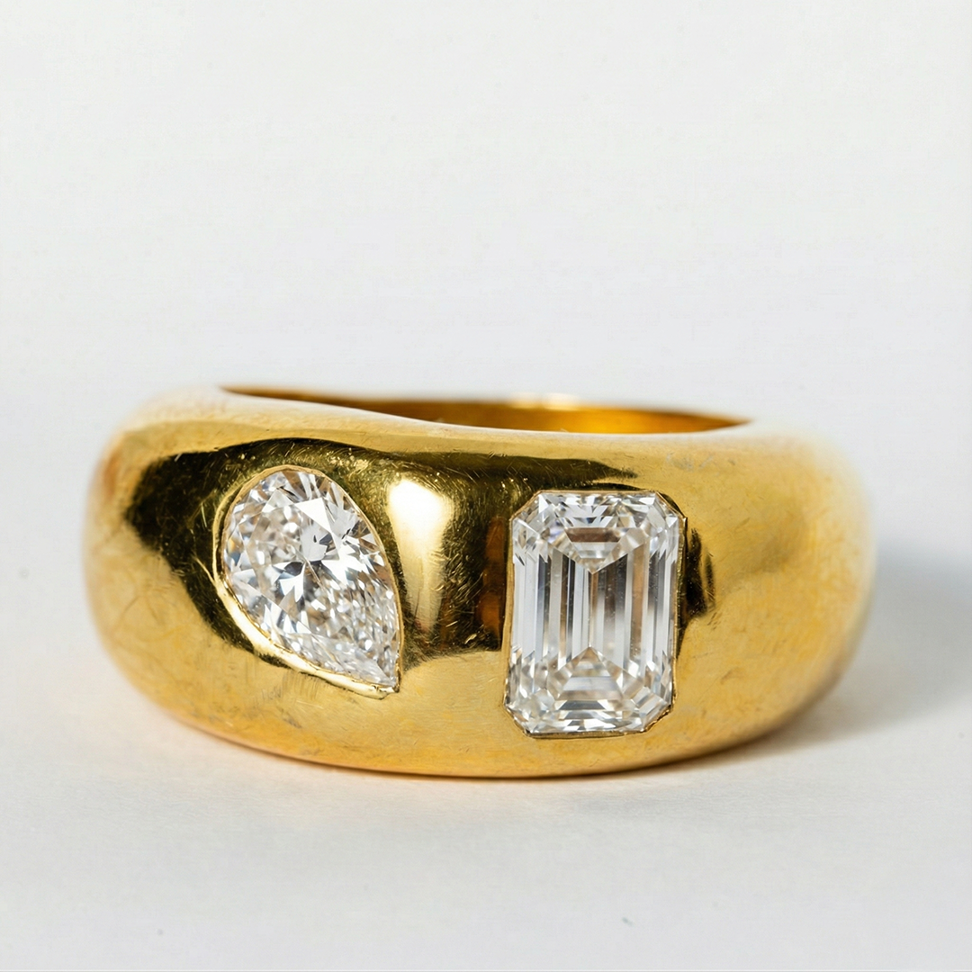 Gold ring with two diamonds on a white background