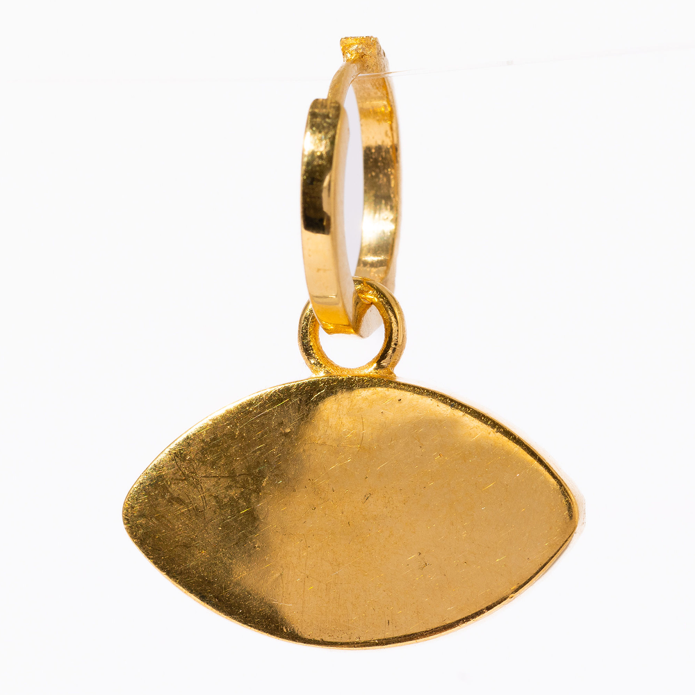 Gold pendant on a white background