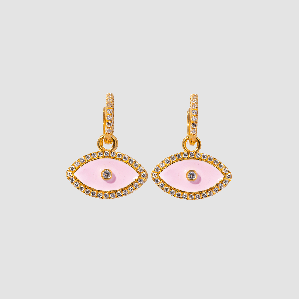 Pair of gold and pink eye-shaped earrings on a light gray background