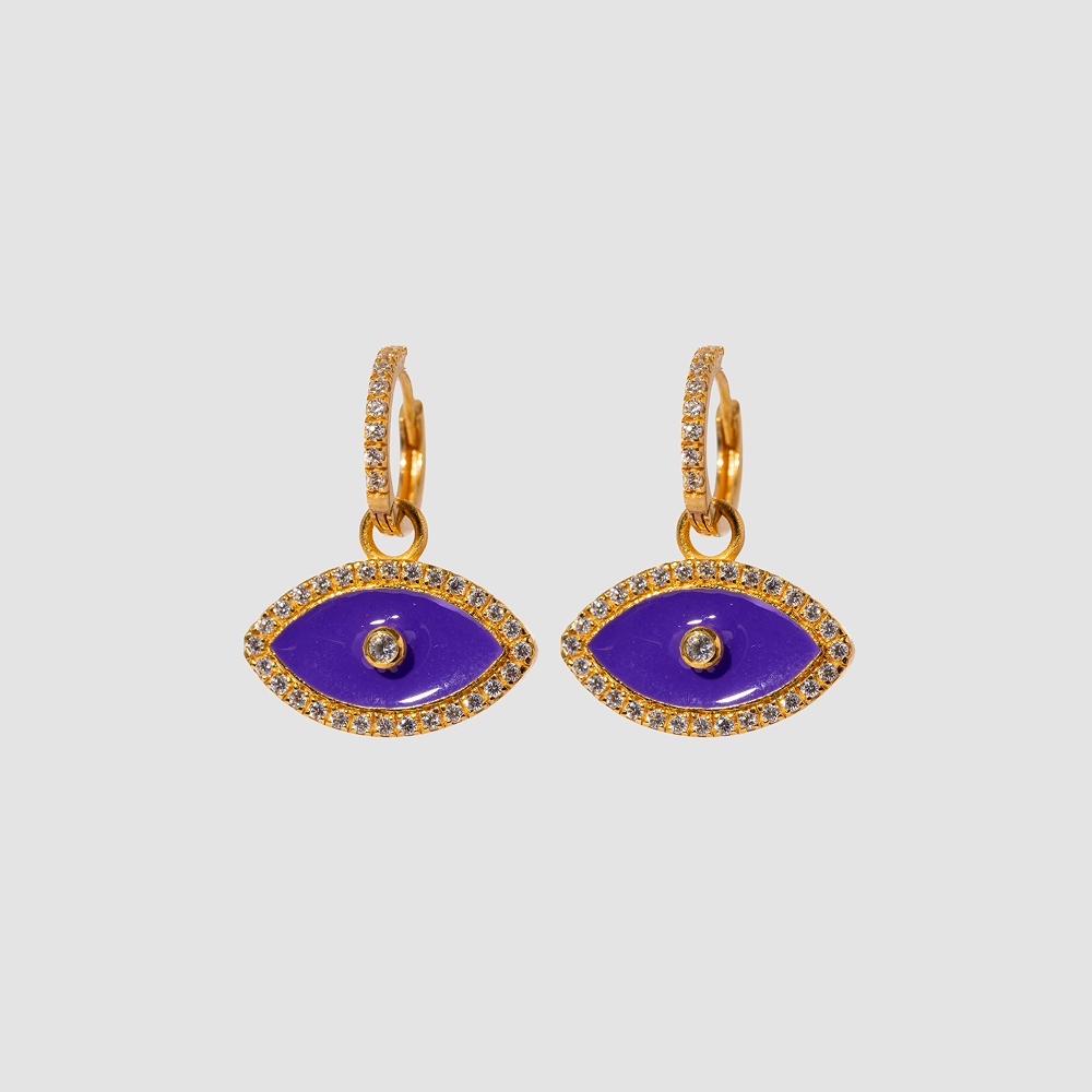 Pair of gold and purple eye-shaped earrings on a light gray background