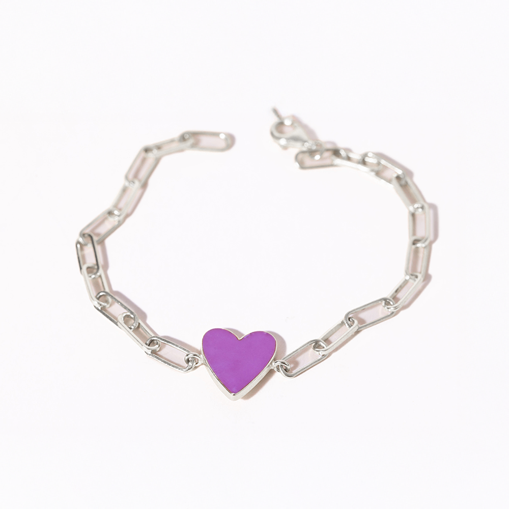 Silver bracelet with a purple heart charm on a white background