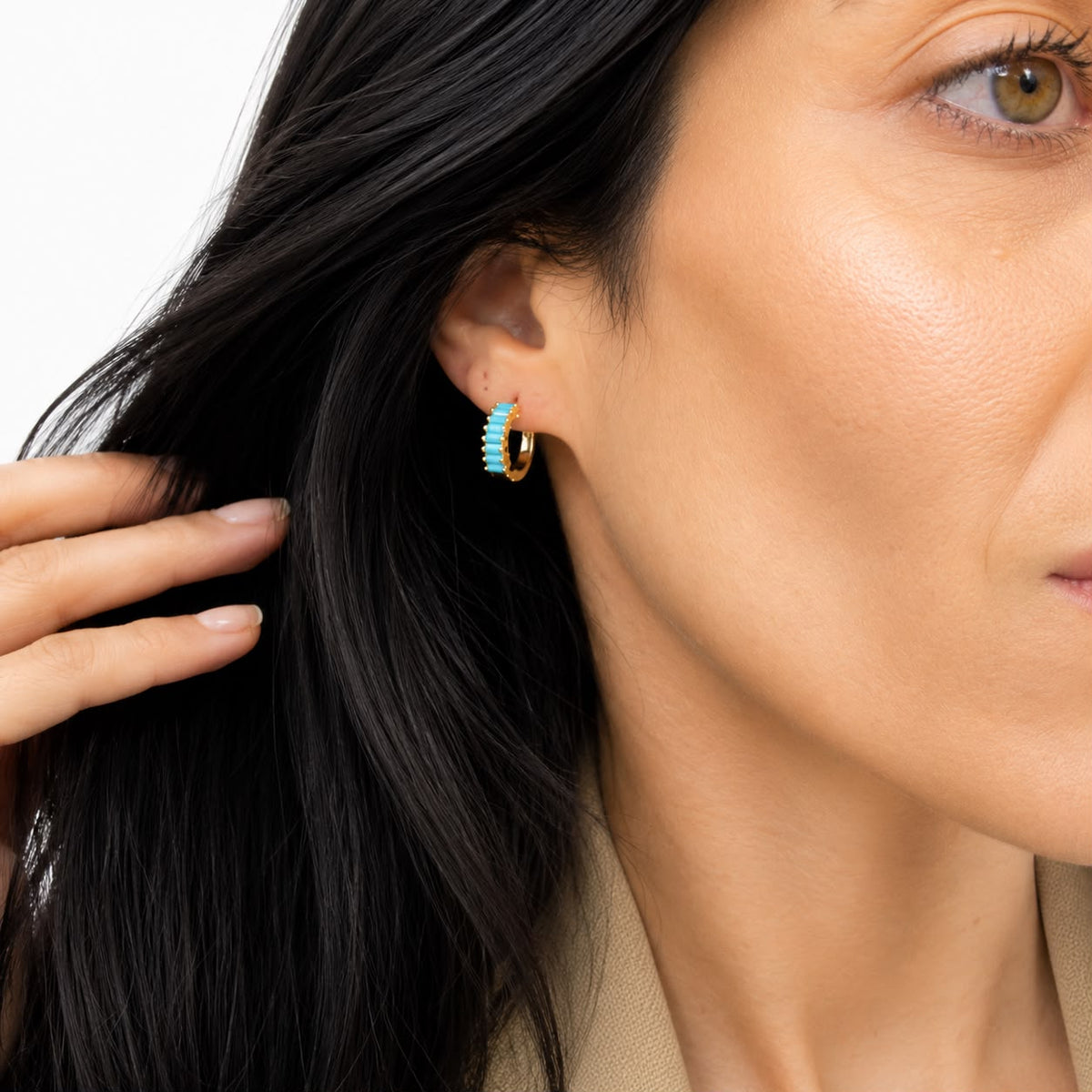 Gigi Huggies in turquoise worn on the ear